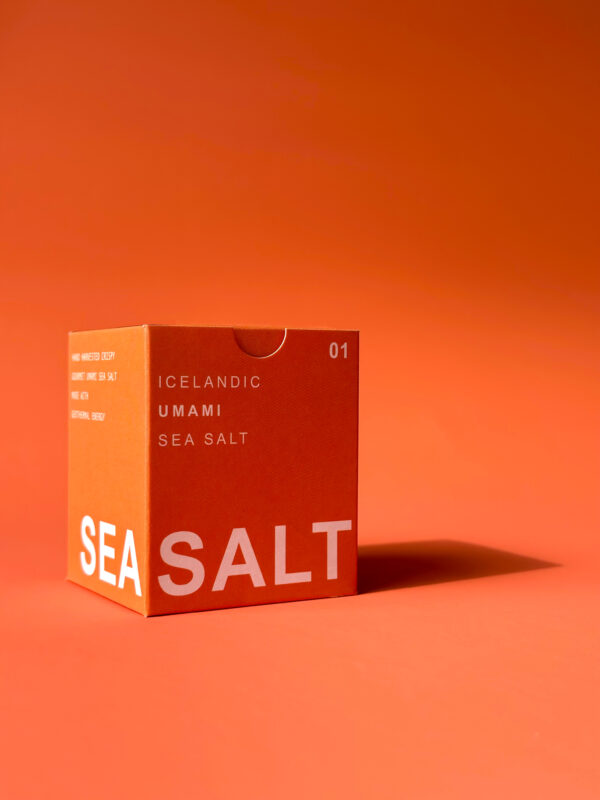 Bold orange box with large ‘SEA SALT’ text for UMAMI SEA SALT TYPE °01 BÁRA, highlighting its seaweed salt content.